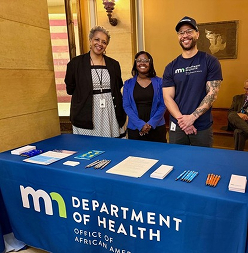 Staff at an exhibit table at 2026 African Heritage Day on the Hill