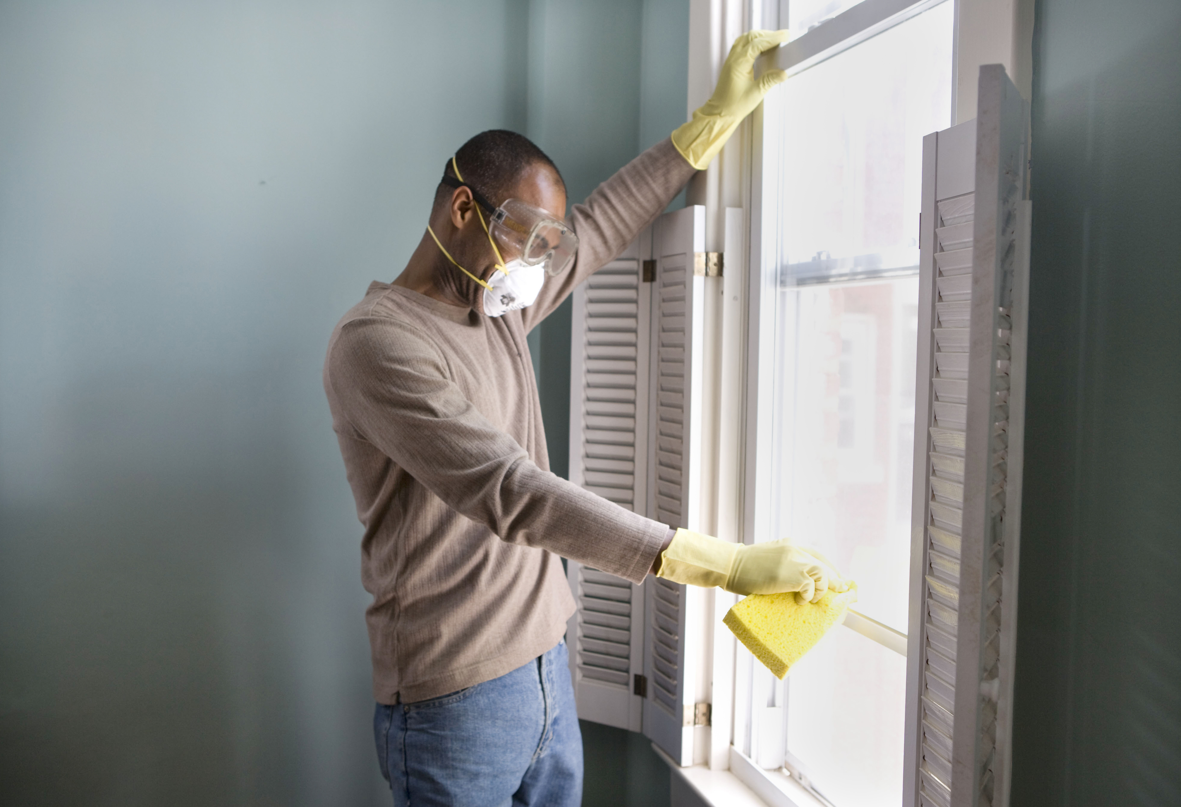 man cleaning windows