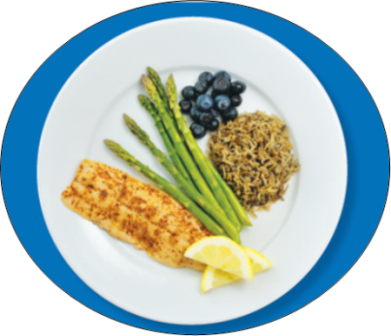 Dinner plate with fish, asparagus, rice, and blueberries.
