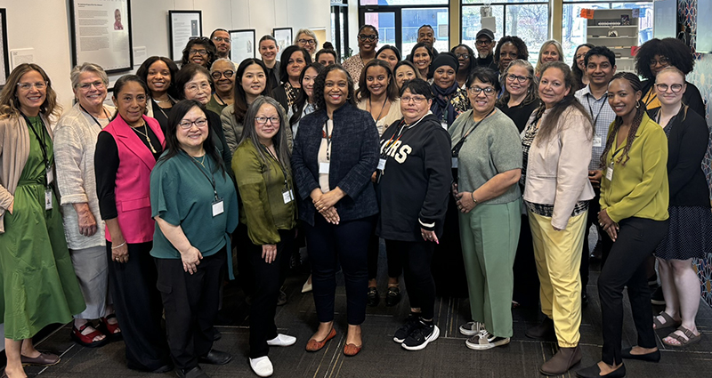 Community Solutions grantees smile for a photo with Commissioner Cunningham