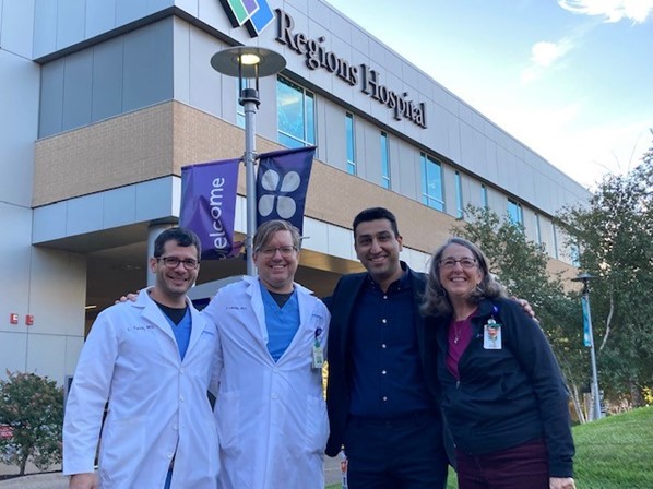 healthcare workers standing outside a hospital