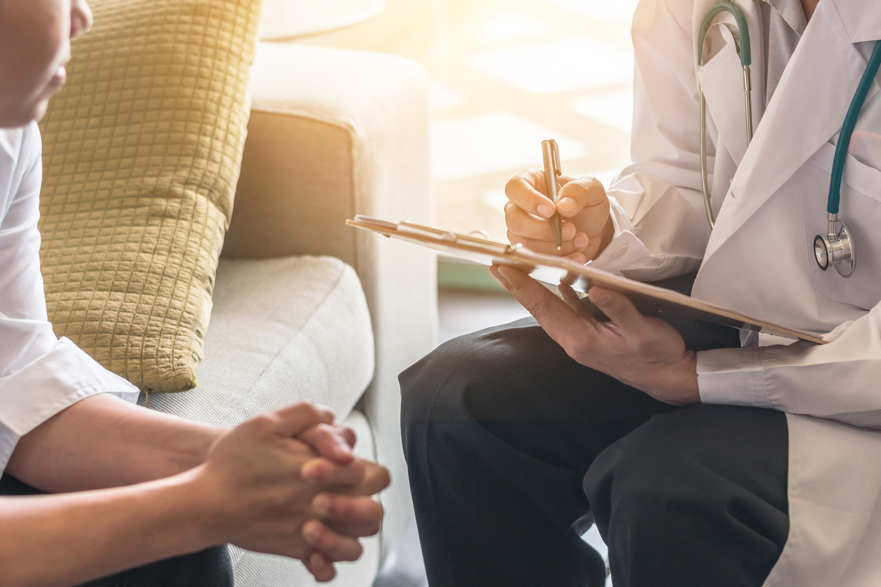 patient and medical provider with clipboard