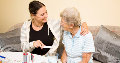 nurse assisting elderly patient