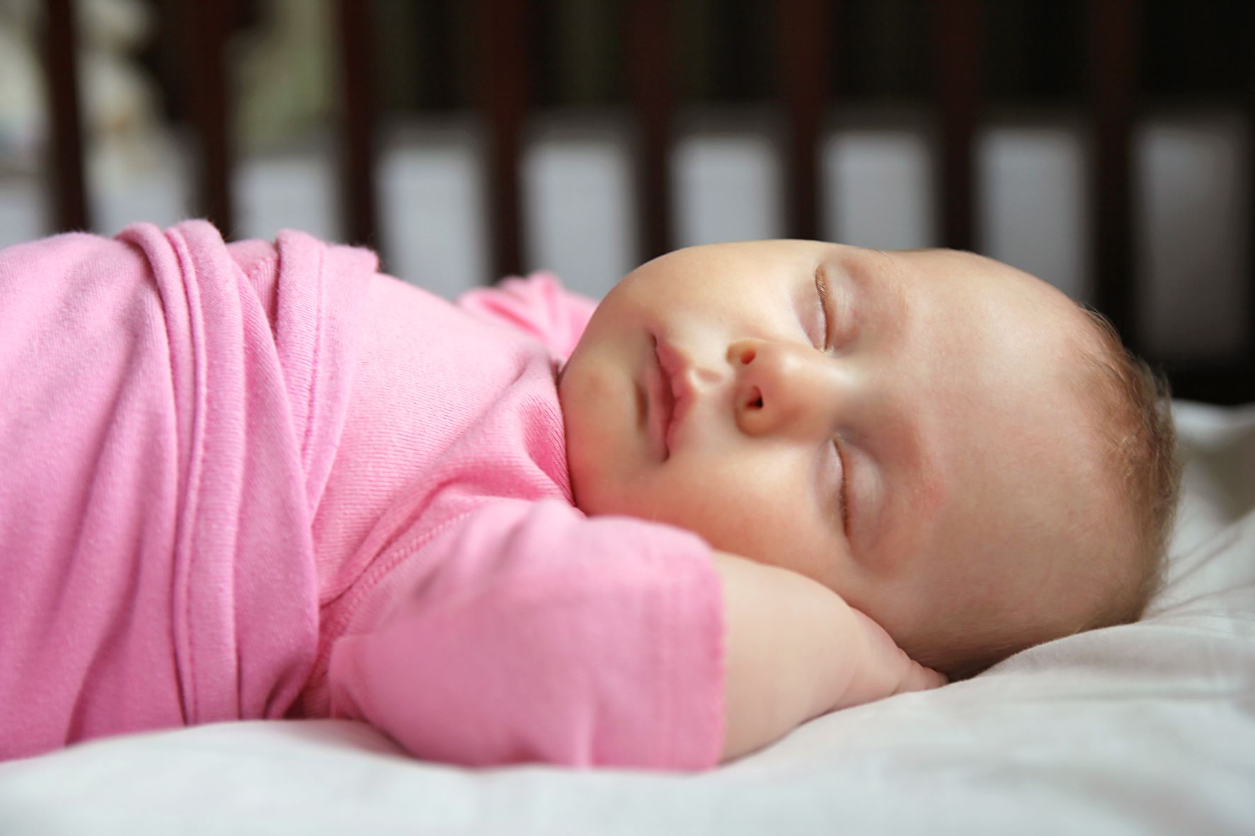 sleeping baby wearing pink