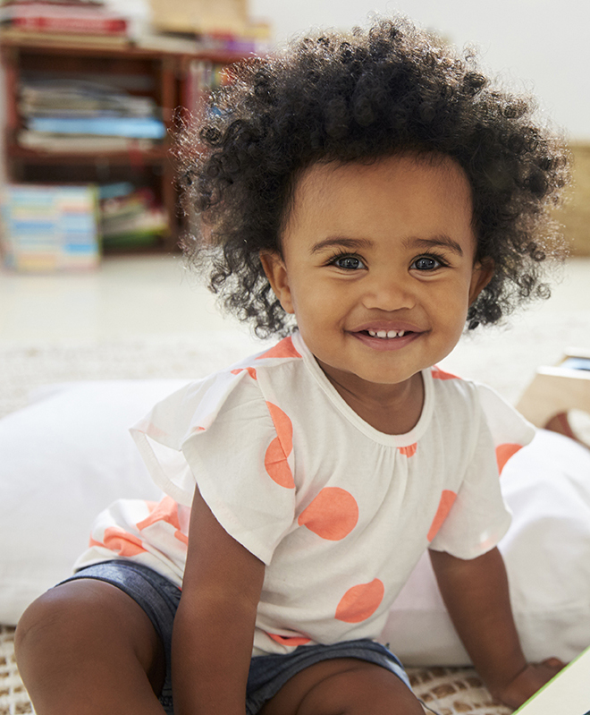 African American baby playing.